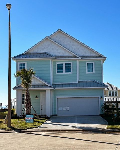 Front exterior of a new home in Grand Cay Harbour, Texas City, TX, highlighting curb appeal (Image 1). Front exterior of a new home in Grand Cay Harbour, Texas City, TX, highlighting curb appeal (Image 1).