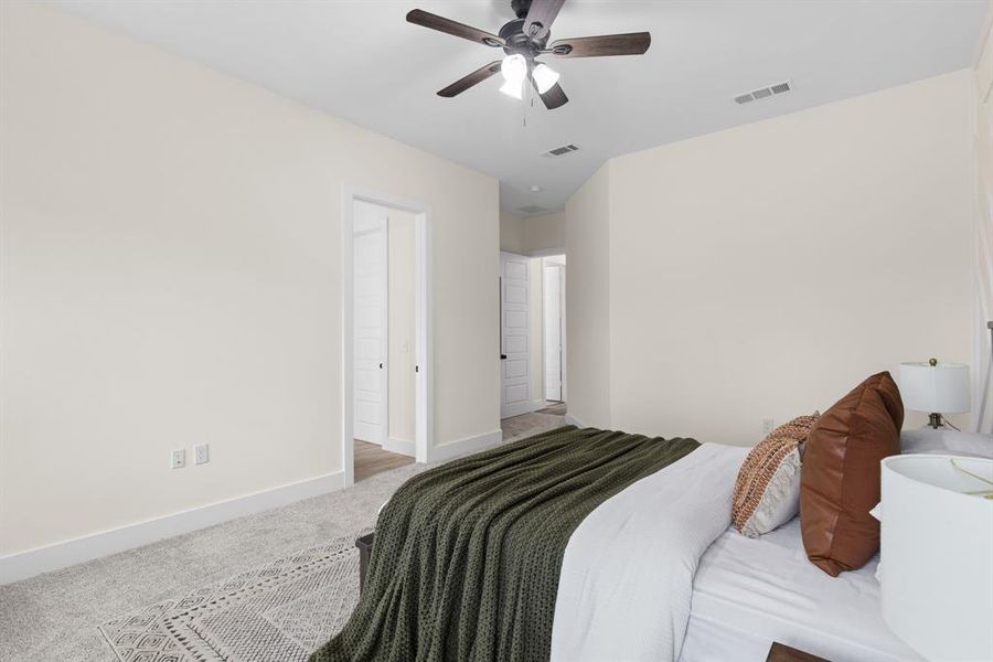 Bedroom with carpet and ceiling fan