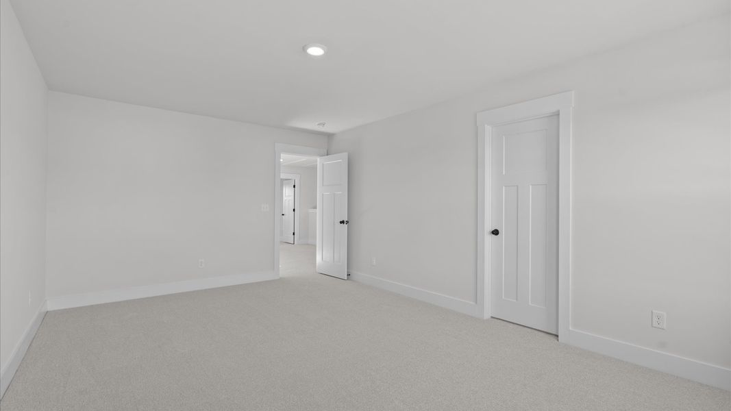 Superior comfort in this light-filled bedroom with plush carpeting and thoughtfully placed large windows Superior comfort in this light-filled bedroom with plush carpeting and thoughtfully placed large windows