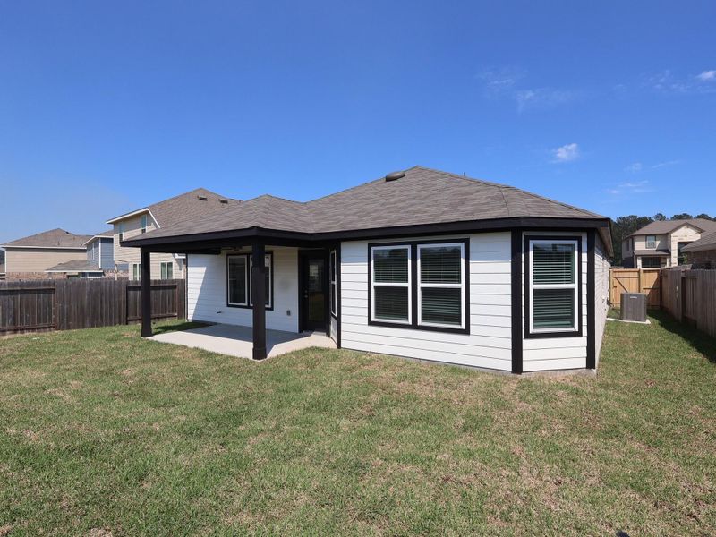 Exterior details and patio area of a home in Magnolia Ridge, Magnolia (Image 20).