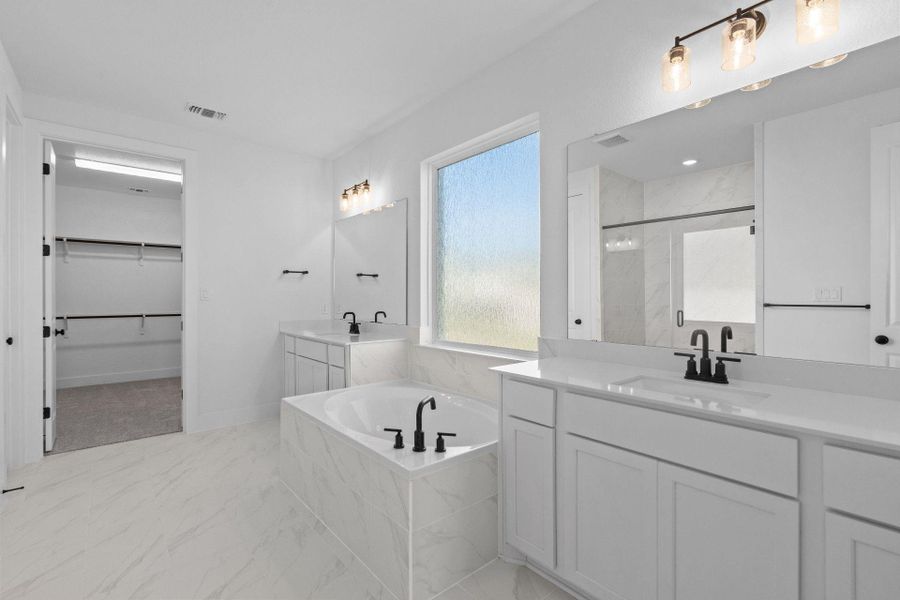 Primary Bath retreat with dual vanities & garden tub
