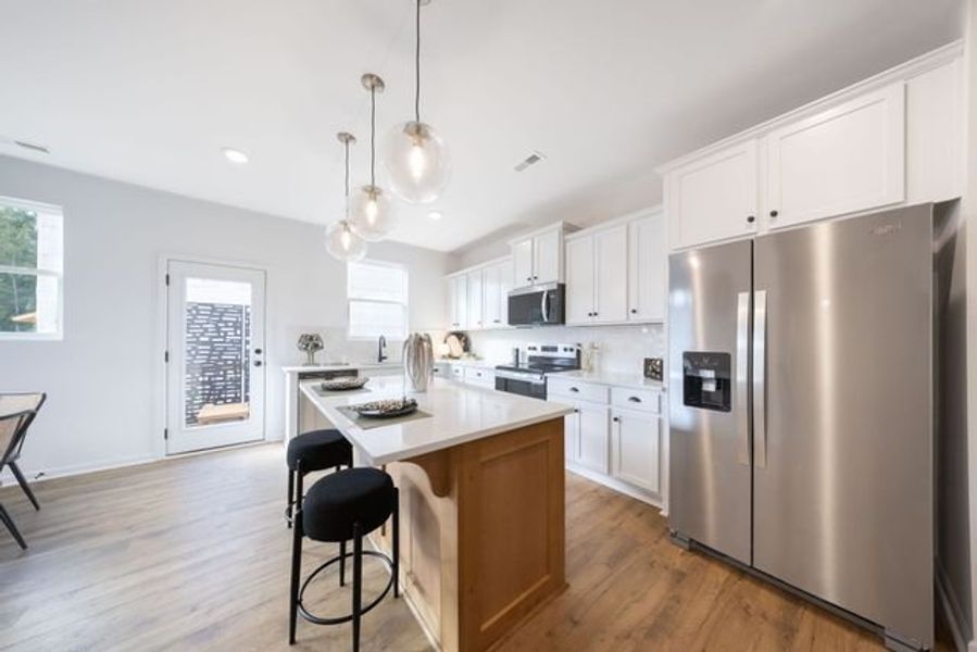 Representative furnished interior of a home built from the Myka TH by True Homes in Village at Reedy Creek Townhomes, Charlotte (Image 5).