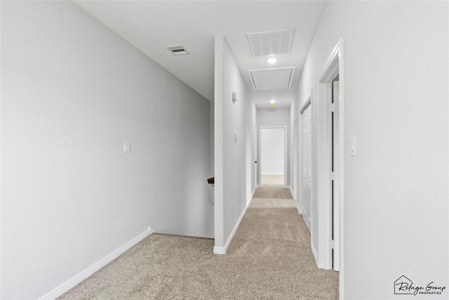 Hallway. Laundry on the right of hallway Hallway. Laundry on the right of hallway