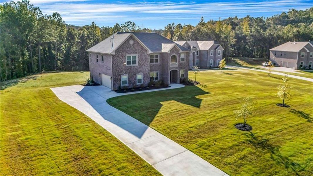 Front exterior of a new home in , Douglasville, GA, highlighting curb appeal (Image 1). Front exterior of a new home in , Douglasville, GA, highlighting curb appeal (Image 1).