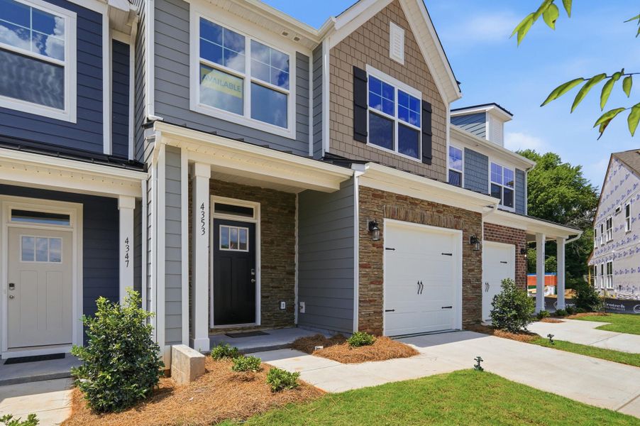 Front exterior of a new home in Harrisburg Village Townhomes, Harrisburg, NC, highlighting curb appeal (Image 2). Front exterior of a new home in Harrisburg Village Townhomes, Harrisburg, NC, highlighting curb appeal (Image 2).
