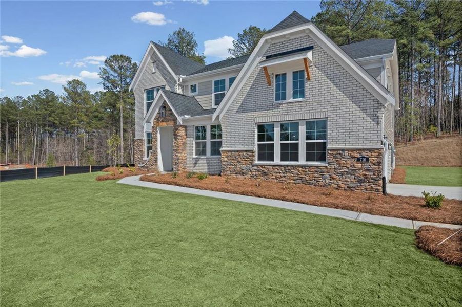 Front exterior of a new home in Governor’s Preserve, Canton, GA, highlighting curb appeal (Image 2). Front exterior of a new home in Governor’s Preserve, Canton, GA, highlighting curb appeal (Image 2).