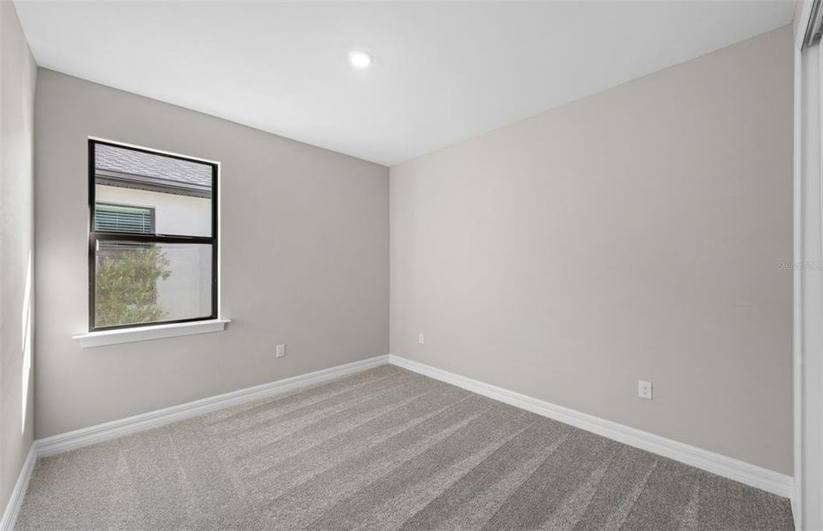 Spacious, unfurnished interior of a new home in The Strand at Cedar Grove, North Port (Image 34).