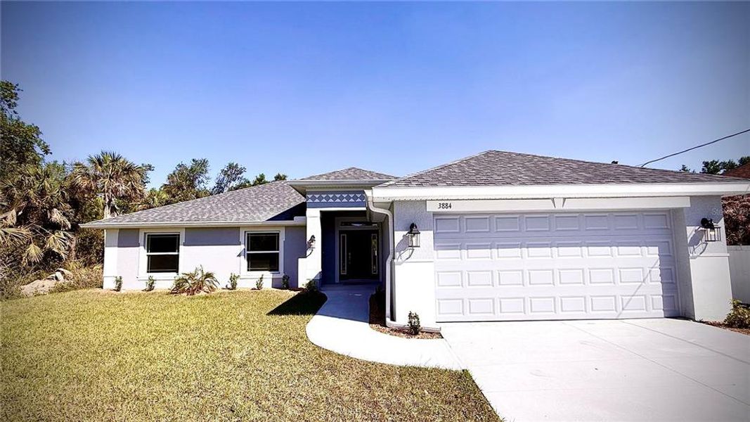 Front exterior of a new home in North Port, North Port, FL, highlighting curb appeal (Image 1).