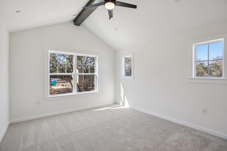 Empty room with carpet flooring and ceiling fan