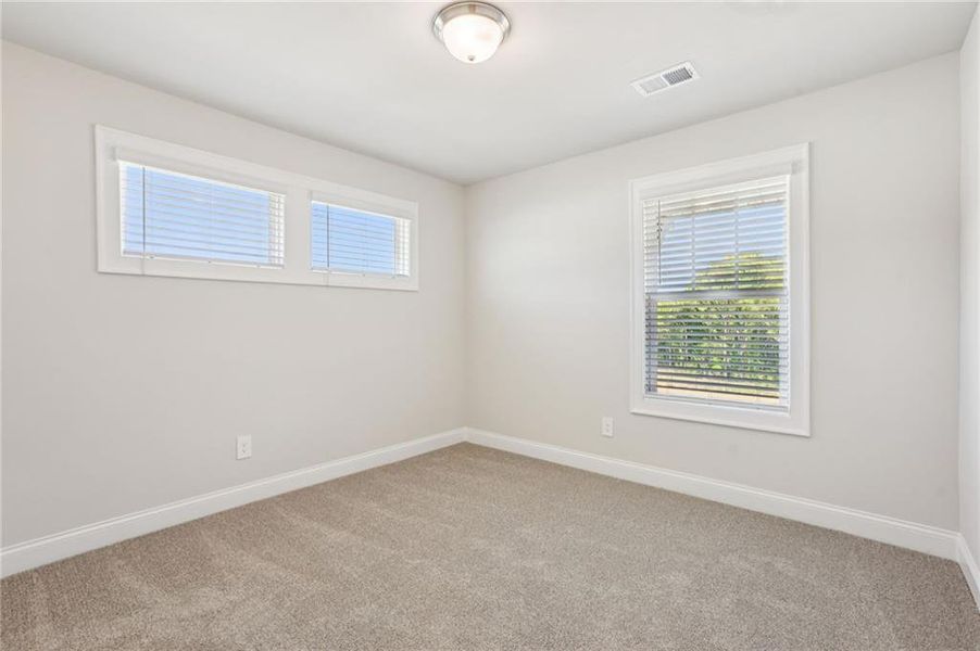 Spacious, unfurnished interior of a new home in Hemingway - Highland Series, Cumming (Image 33).