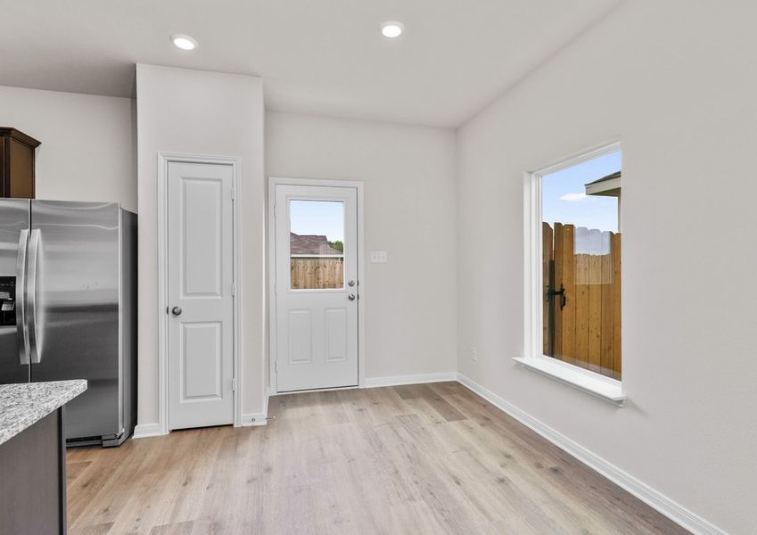 The dining room sits adjacent to the kitchen.