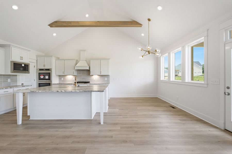 Furnished interior view inside a new home in Aden Woods, Fairview (Image 10).