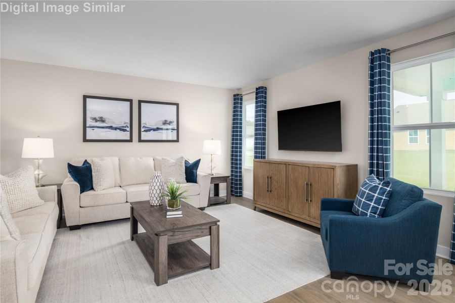 Sunlit Great Room with Expansive Windows - Ideal for Hosting.