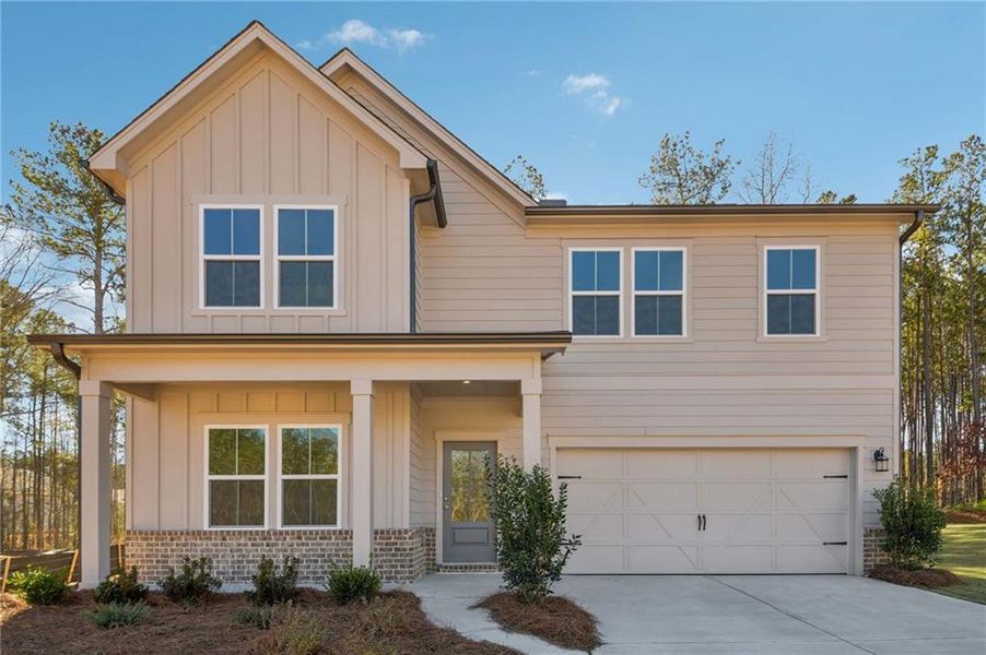 Front exterior of a new home in The Pointe at Heron Bay, Locust Grove, GA, highlighting curb appeal (Image 20).