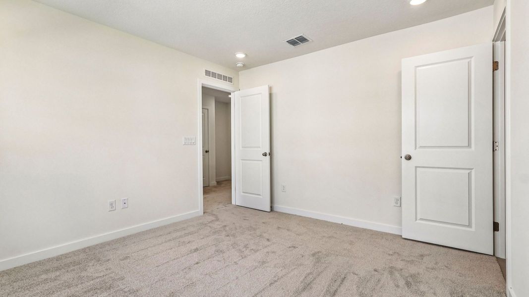Furnished interior view inside a new home in Cyrene at Harmony, St. Cloud (Image 23).