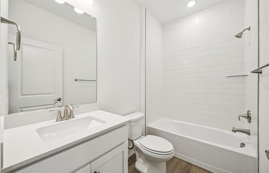 Upgraded secondary bath with elegant finishes *Real home pictured