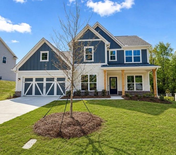 Front exterior of a new home in Berkeley Mill, Cumming, GA, highlighting curb appeal (Image 1). Front exterior of a new home in Berkeley Mill, Cumming, GA, highlighting curb appeal (Image 1).