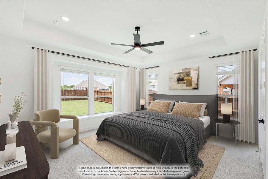 Bedroom with king bed, ceiling fan, large windows, and neutral carpet flooring