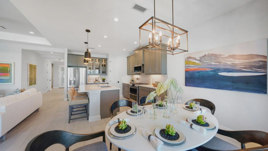 Representative furnished interior of a home built from the Meadow Brook by Neal Communities in SkySail, Naples (Image 9).