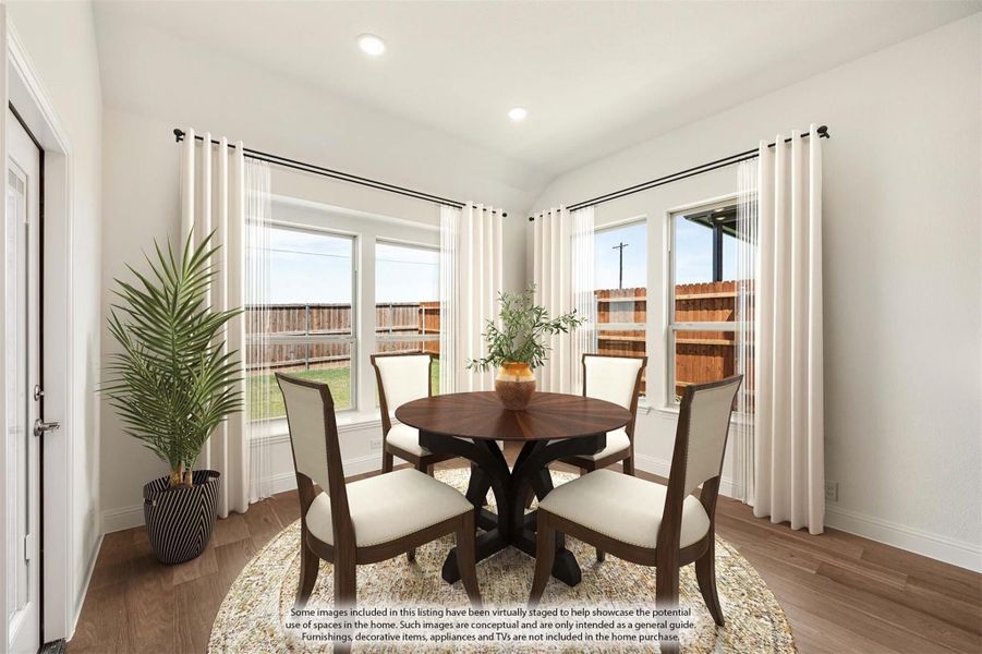 Dining area with round wood table, four upholstered chairs, hardwood floors, and large windows with white curtains Dining area with round wood table, four upholstered chairs, hardwood floors, and large windows with white curtains