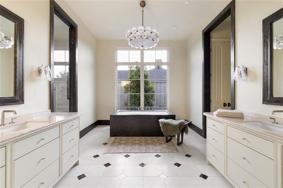 Bathroom with two vanities and a chandelier Bathroom with two vanities and a chandelier