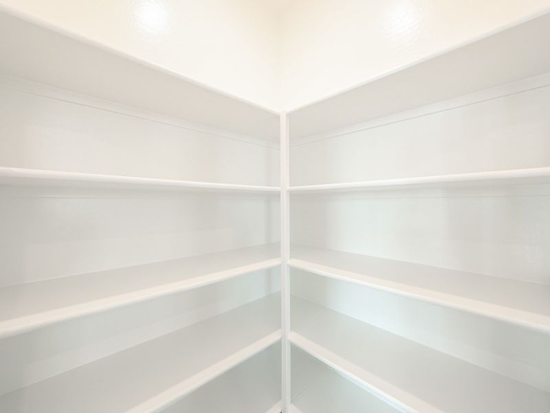 A white shelf with white shelves. A white shelf with white shelves.