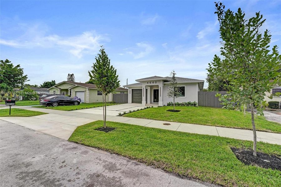 Front exterior of a new home in , West Park, FL, highlighting curb appeal (Image 33). Front exterior of a new home in , West Park, FL, highlighting curb appeal (Image 33).