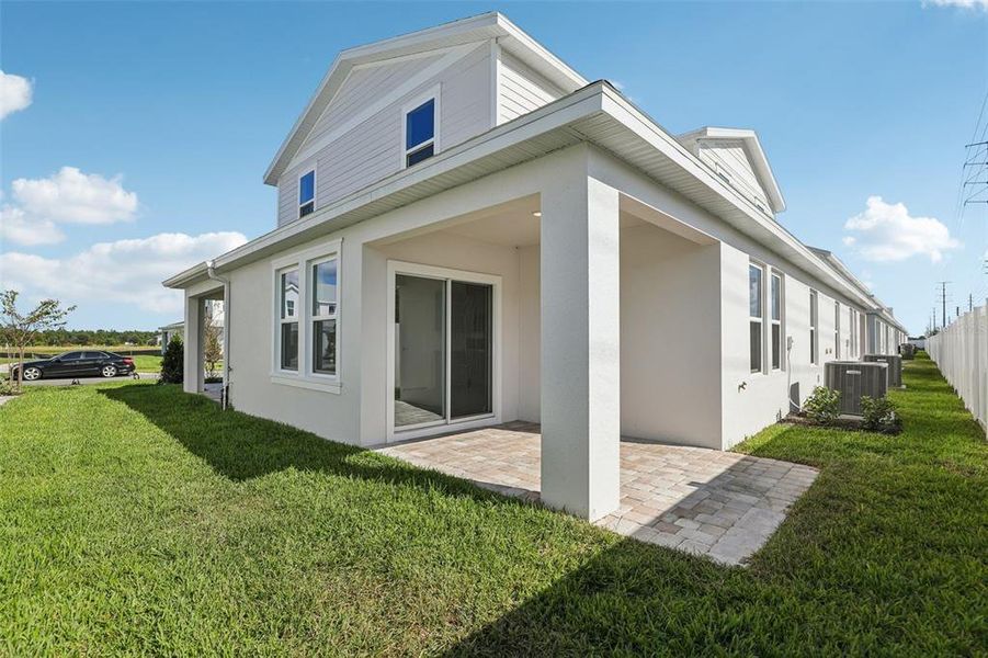 Exterior details and patio area of a home in Cyrene at Harmony, St. Cloud (Image 2). Exterior details and patio area of a home in Cyrene at Harmony, St. Cloud (Image 2).