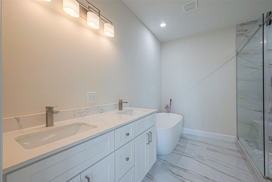 Unit 2: Primary bath double vanity.