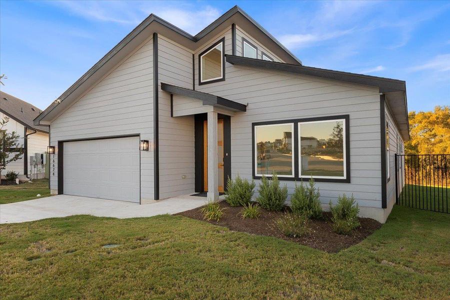 View of front of property featuring driveway View of front of property featuring driveway
