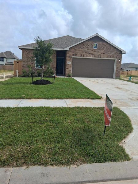 Front exterior of a new home in Windrose Green, Angleton, TX, highlighting curb appeal (Image 2). Front exterior of a new home in Windrose Green, Angleton, TX, highlighting curb appeal (Image 2).