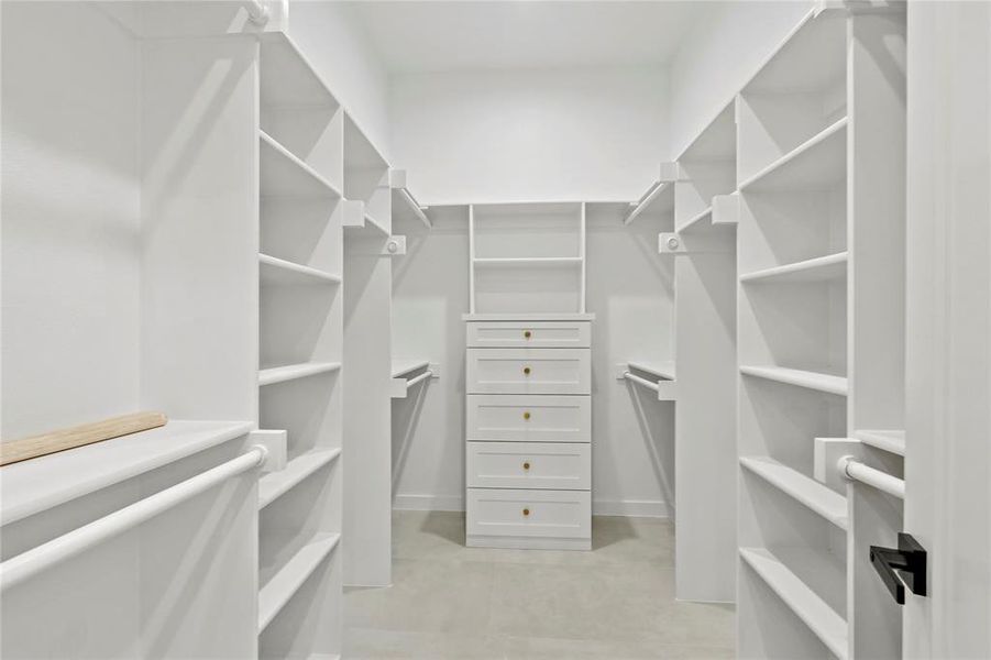 Walk in closet featuring light tile patterned floors