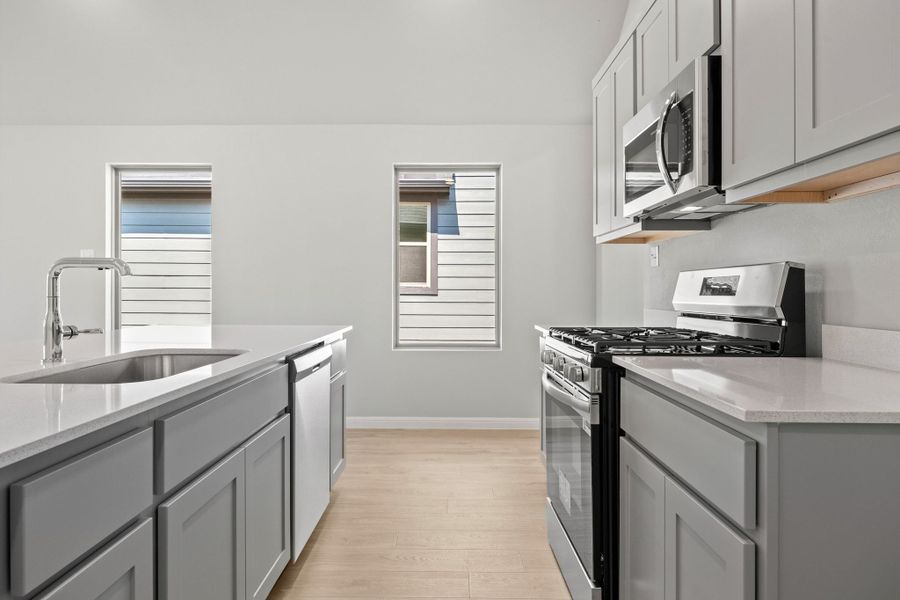 Kitchen in the Spruce home plan by Trophy Signature Homes - REPRESENTATIVE PHOTO Kitchen in the Spruce home plan by Trophy Signature Homes - REPRESENTATIVE PHOTO