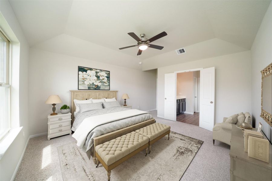 Come decompress in the stunning primary suite after a lengthy day! Experience the luxury of plush carpeting, warm paint hues, high ceilings, and large windows featuring privacy blinds. Sample photo of completed home with similar floor plan. As-built interior colors and selections may vary.