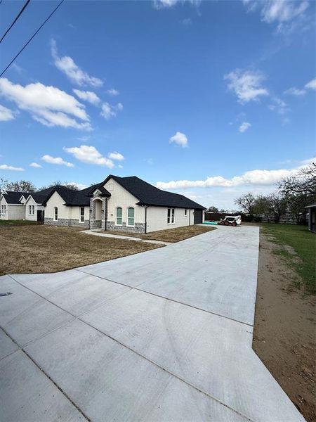 Front exterior of a new home in , Balch Springs, TX, highlighting curb appeal (Image 1). Front exterior of a new home in , Balch Springs, TX, highlighting curb appeal (Image 1).