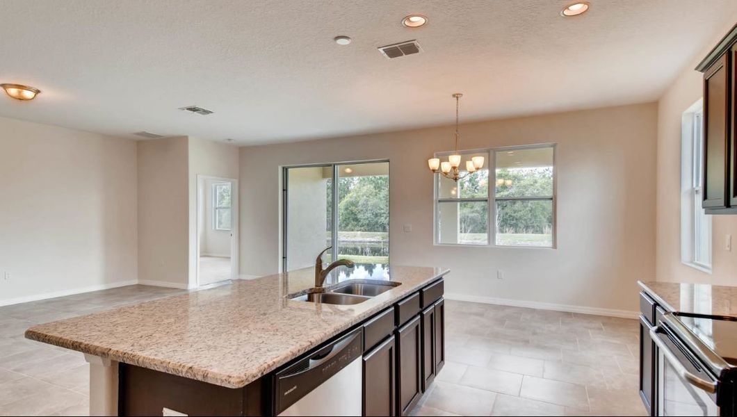 Furnished interior in a model home at Preserves at Lakeside Landings in Winter Haven (Image 27).