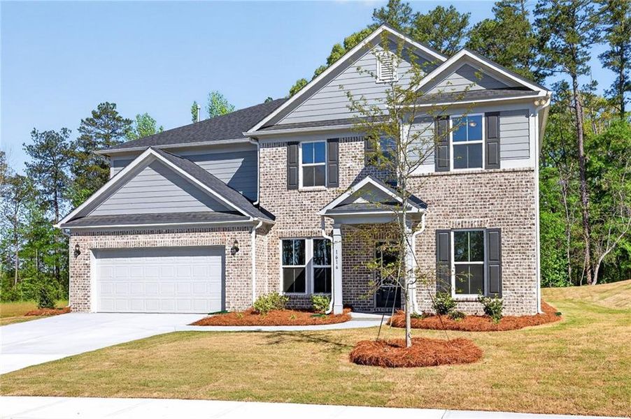 Front exterior of a new home in Riversprings, Dacula, GA, highlighting curb appeal (Image 28).