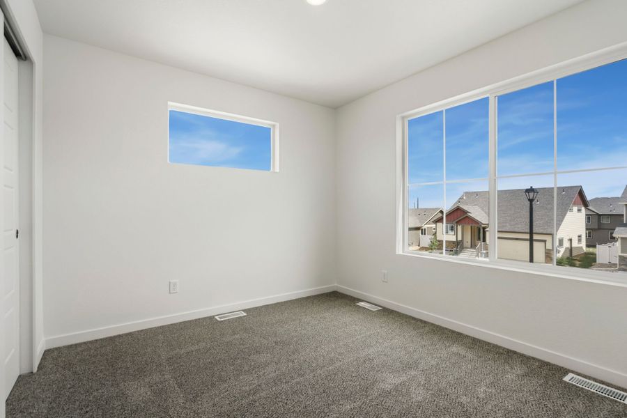 Spacious, unfurnished interior of a new home in Union Colony West, Greeley (Image 18).
