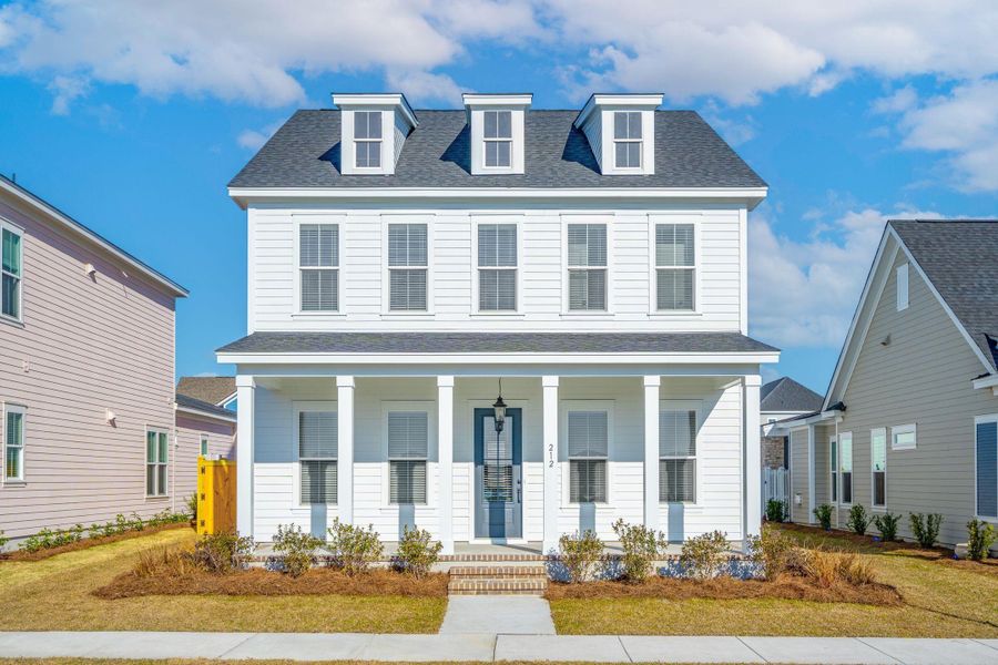 Front exterior of a new home in Nexton, Summerville, SC, highlighting curb appeal (Image 2). Front exterior of a new home in Nexton, Summerville, SC, highlighting curb appeal (Image 2).