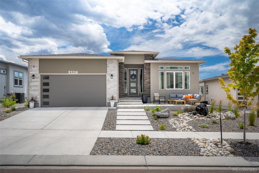 Front exterior of a new home in , Colorado Springs, CO, highlighting curb appeal (Image 23).