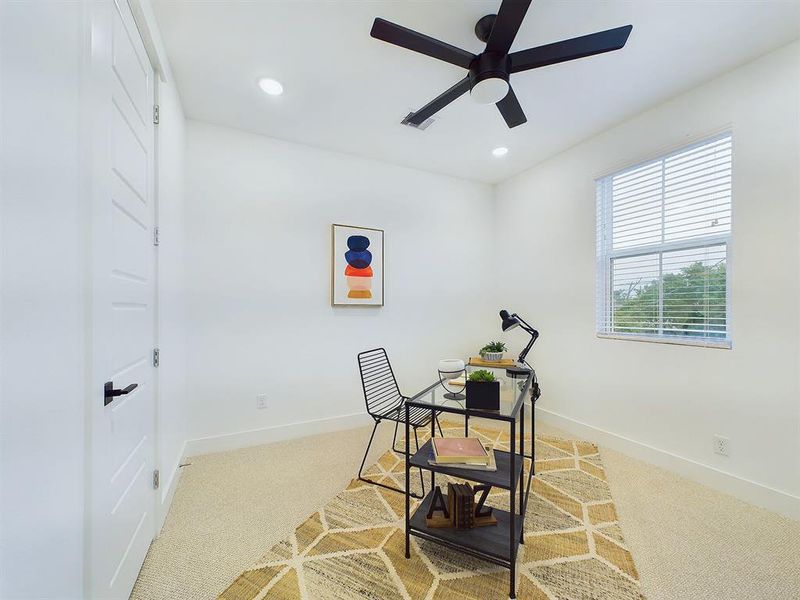 Secondary Bedroom located on the first floor. Vinyl windows with retractable panels allow in tons of natural light.