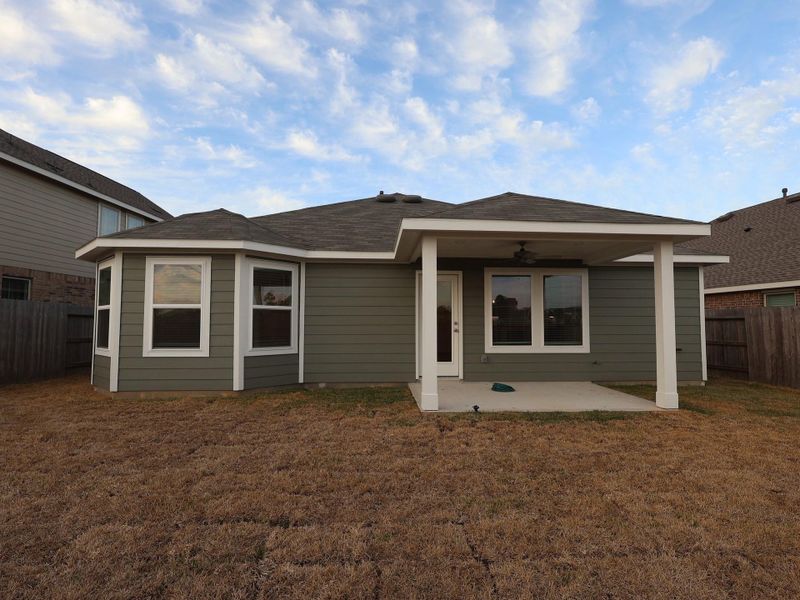 Exterior details and patio area of a home in Pinewood at Grand Texas, New Caney (Image 4).