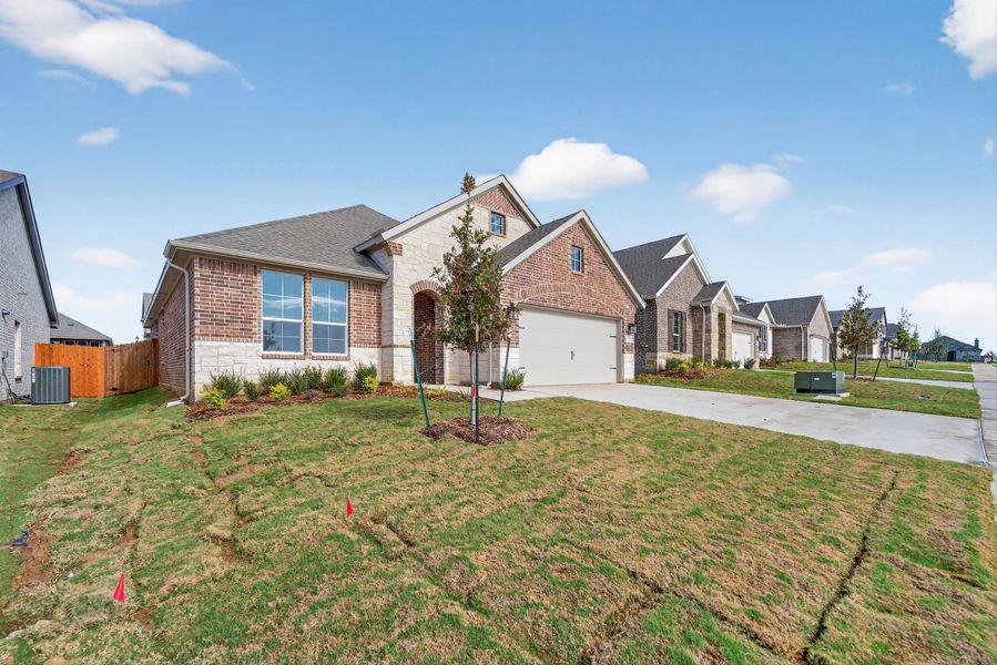 Front exterior of a new home in Liberty Pointe, Gainesville, TX, highlighting curb appeal (Image 2). Front exterior of a new home in Liberty Pointe, Gainesville, TX, highlighting curb appeal (Image 2).