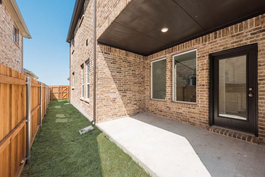 Exterior details and patio area of a home in Elevon, Lavon (Image 3).