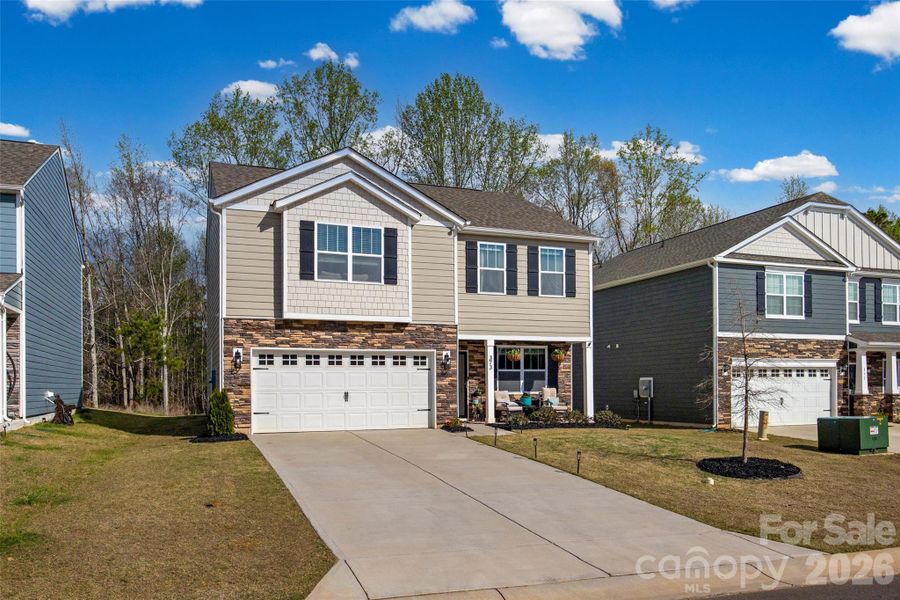 Front exterior of a new home in Fergus Crossing, York, SC, highlighting curb appeal (Image 2). Front exterior of a new home in Fergus Crossing, York, SC, highlighting curb appeal (Image 2).