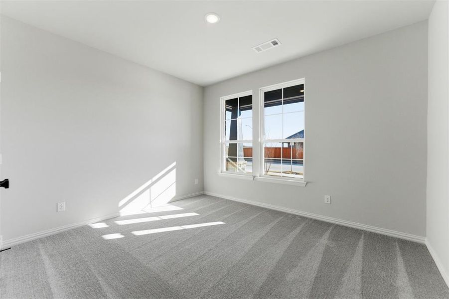 Unfurnished room featuring light colored carpet and recessed lighting