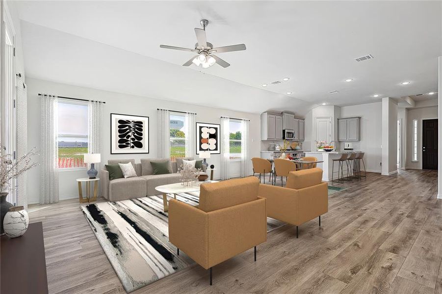 Living room featuring light wood-type flooring and ceiling fan