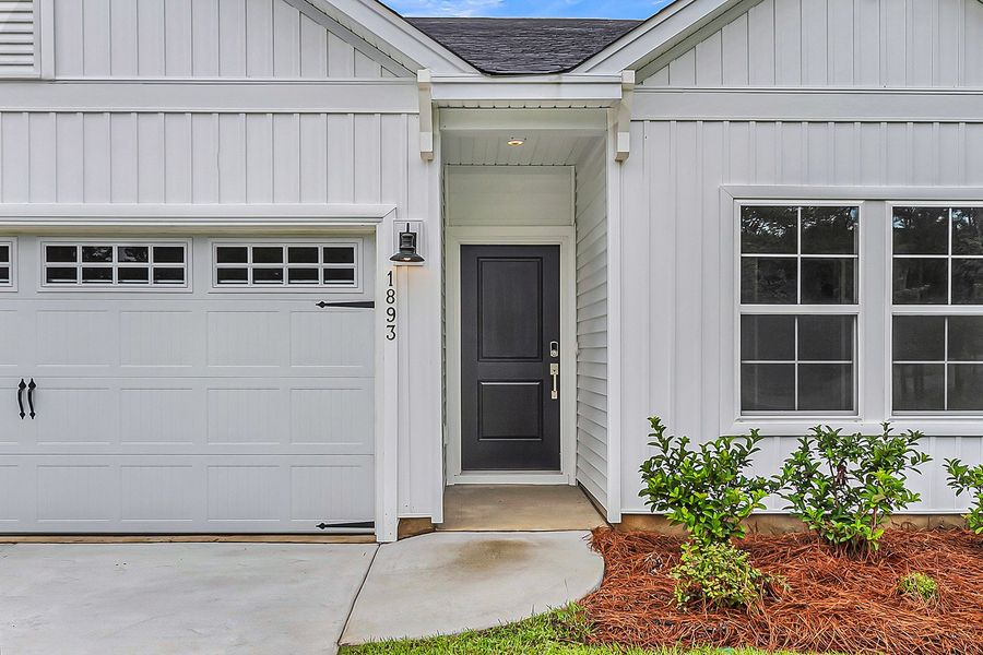 Exterior details and patio area of a home in Fairway Woods at Wyboo, Manning (Image 3).