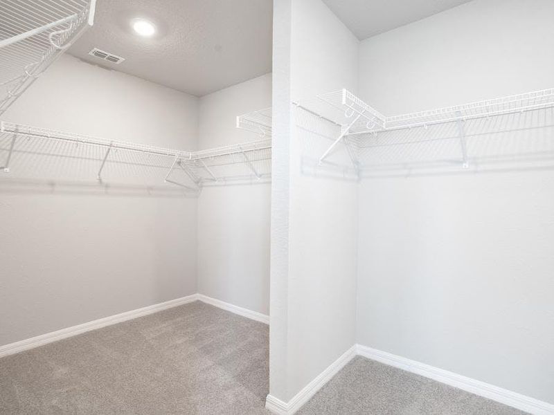 Walk-in wardrobe in owner`s suite - Capri home plan by Highland Homes Walk-in wardrobe in owner`s suite - Capri home plan by Highland Homes