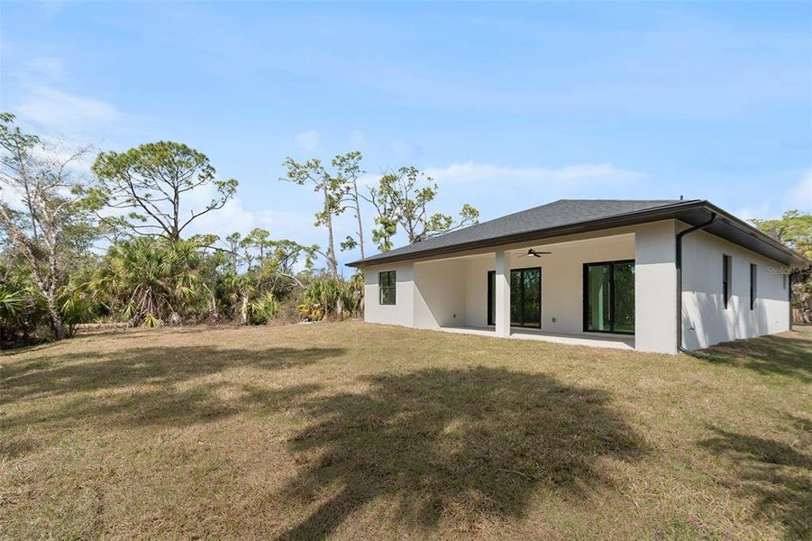 Exterior details and patio area of a home in , North Port (Image 24).
